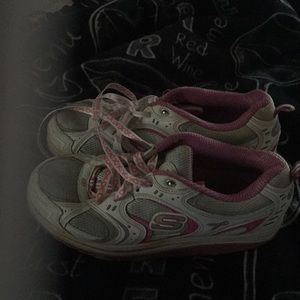 Woman sketchers tennis shoes.